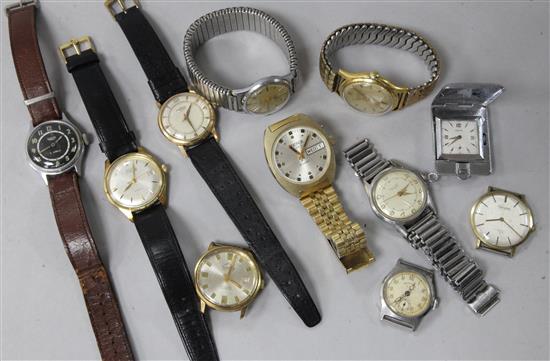 Ten assorted gentlemens wrist watches including, Baume, Roamer Avia and Junghans and a travelling watch.